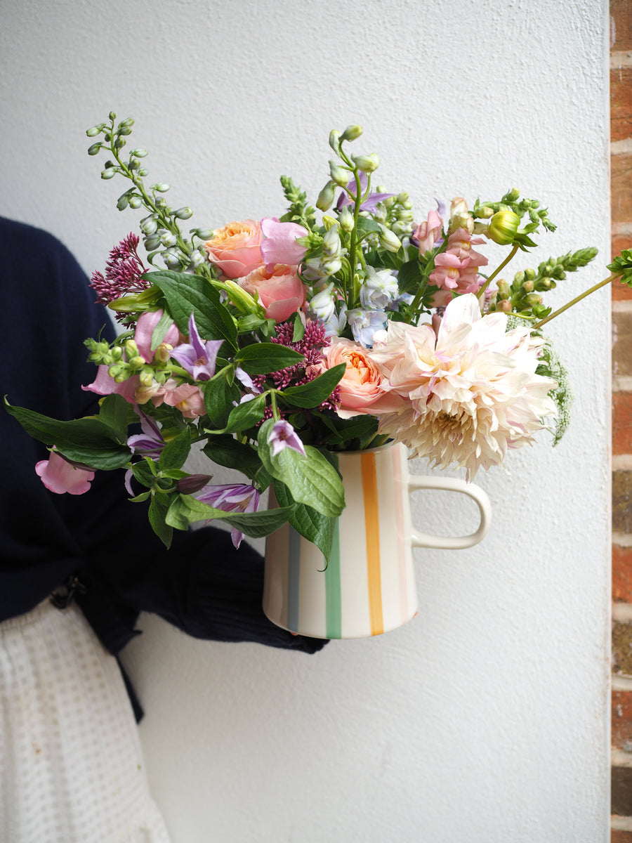 Caroline Gardener Stripe Jug Filled With Seasonal Flowers